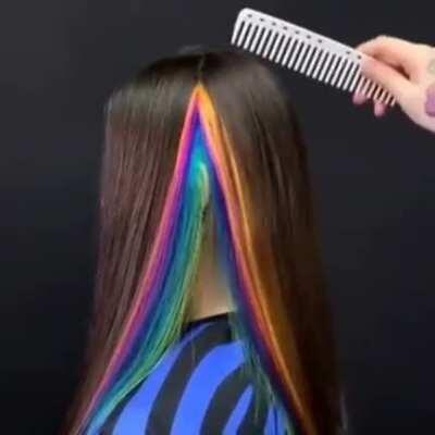 This rainbow hair coloring hidden under her natural hair.