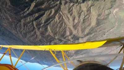 Biplane flying aerobatics over San Diego