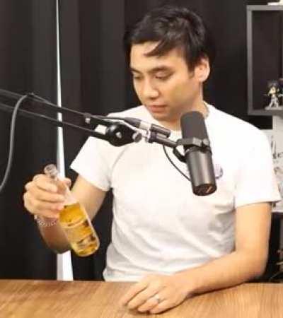 Garnt notices he's drinking Corona and laughs to himself