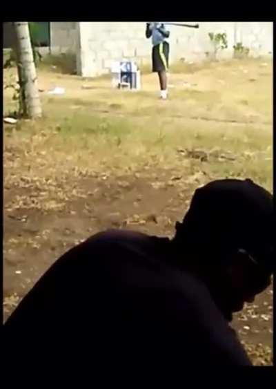 kid in the Dominican Republic is batting bottle caps off a slingshot