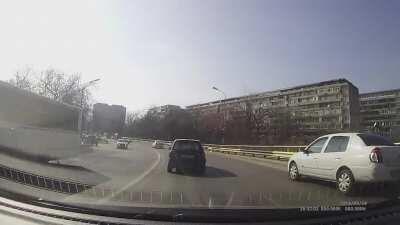 Idiot in a stupid hurry tries to undertake and goes wrong.