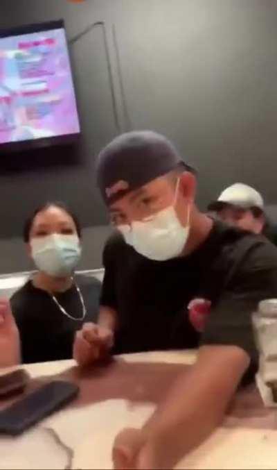 A black woman screams at Asian boba tea employees for cultural appropriation. She felt Boba tea is black culture. When a black man in line behind her spoke up she called him a slur.