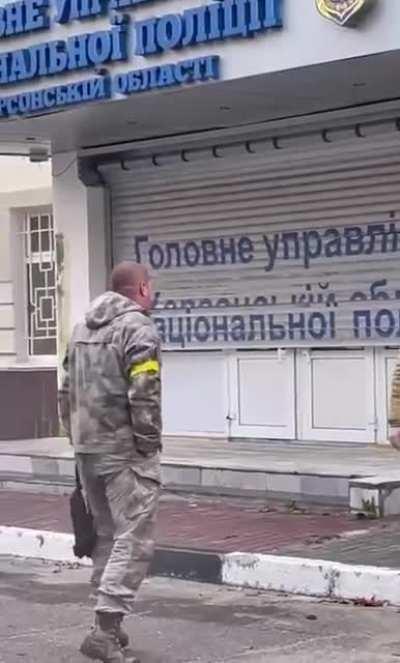 The Ukrainian flag is raised on the building of the police headquarters in Kherson.