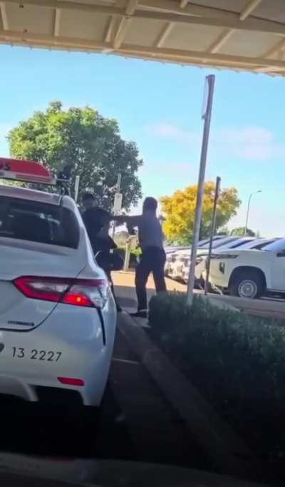 Cab drivers fighting outside an airport in regional Australia