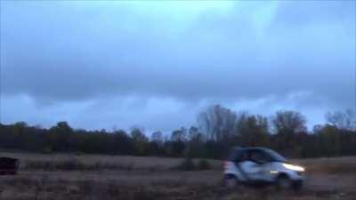 Pulling a Smart car out of the mud