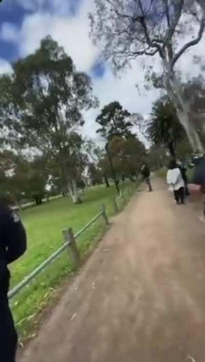 Melbourne Police grab a man's coffee to check if there was any left. If not, he would have been fined for not wearing a mask.