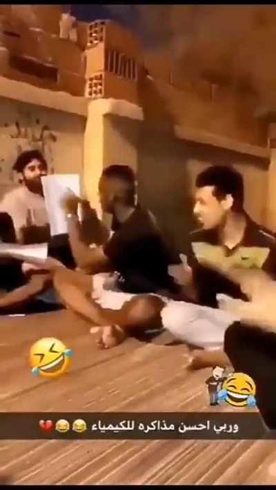 Arab guys studying chemistry