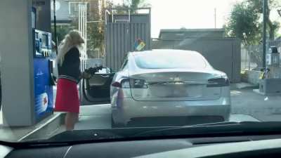 She can't figure out how to fill her Tesla