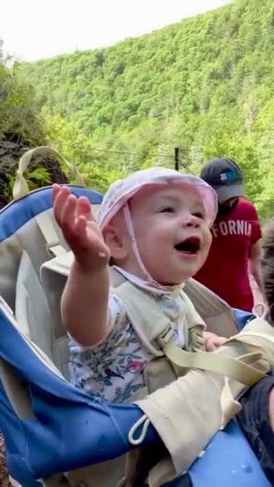 Go through life maintaining a sense of wonder as strong as this baby experiencing a waterfall for the first time