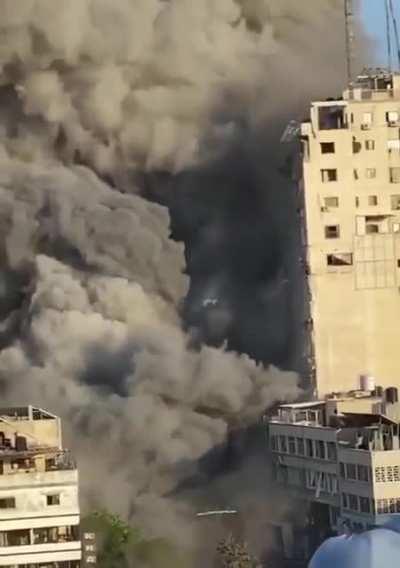 Israeli targeted airstrikes destroy international media building headquarters of Al Jazeera, Associated Press and other media outlets in Gaza.
