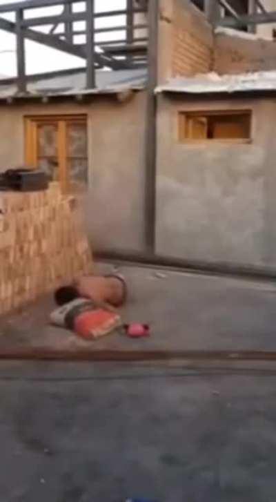 Throwing bags of mortar mix at a construction site