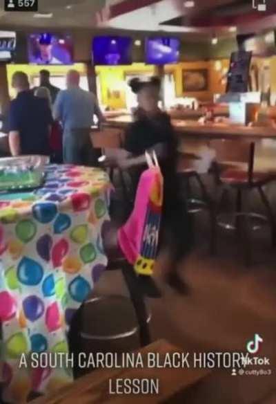 Racist gets sense slapped into him.