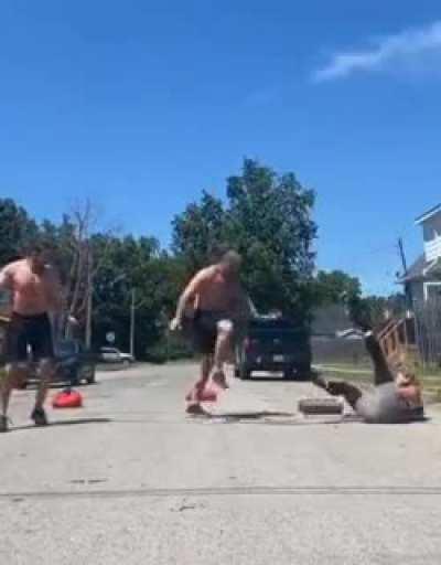 Throw a pack of weights in the air and catch it with ur neck