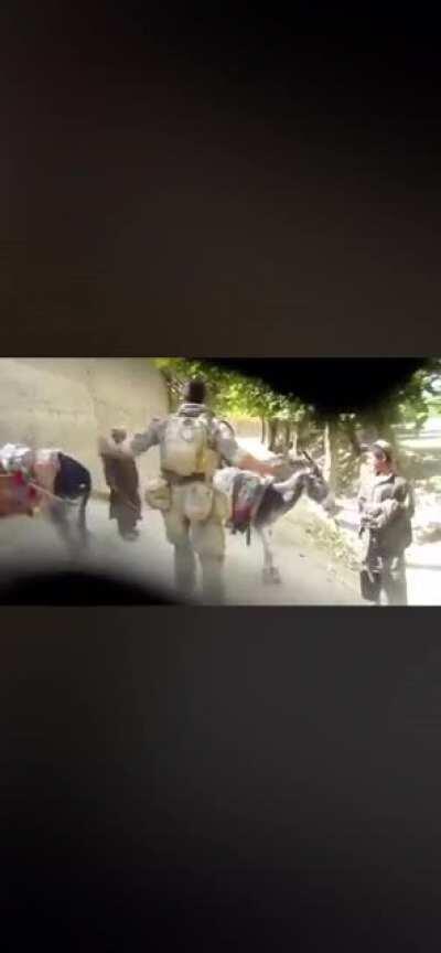 US soldier harassing Afghani kids & pointing his gun at them as a joke