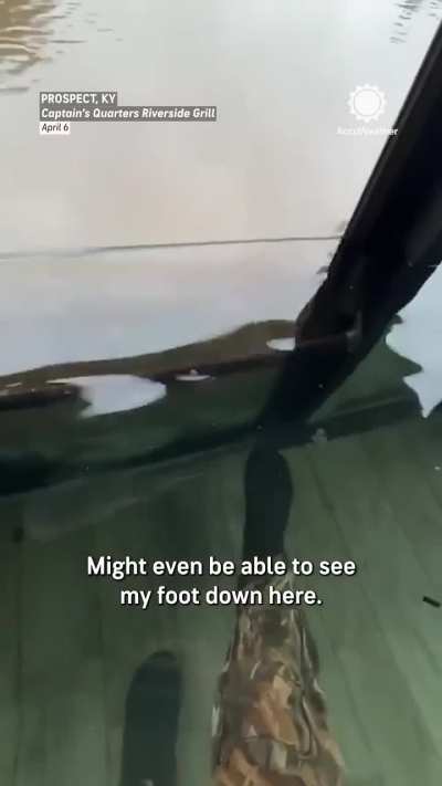 Owner fills restaurant with fresh water to stop muddy flood waters from entering.