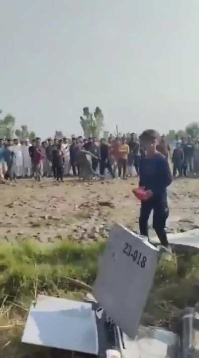 Pakistanis beating a drone, that's their own