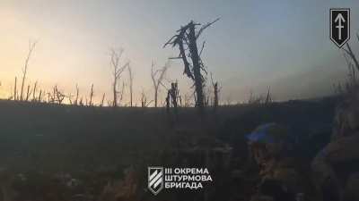 After a direct hit on their APC, Ukrainian soldiers dismount, set up circular defense, and help evacuate wounded, all under heavy enemy fire.