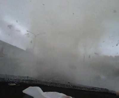 White car cuts off driver and gets swallowed by a tornado