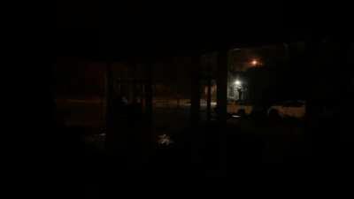 Five minutes corner with rain and thunder, handheld.