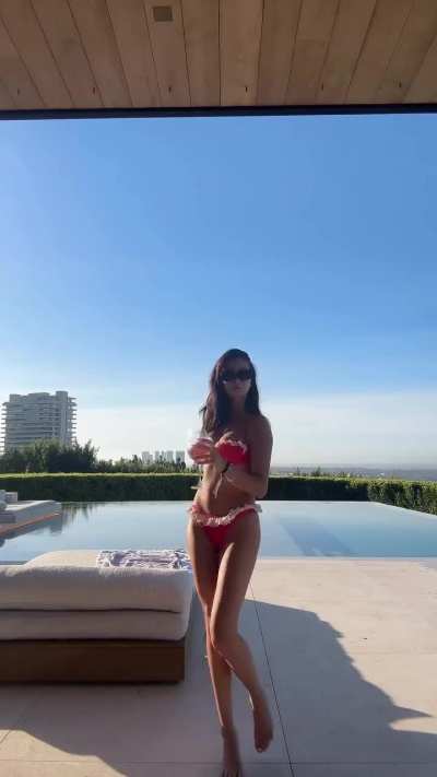 Strutting her Stuff in a Pink / Red Thong Bikini with White Ruffles (Mishka Silva IG Clip)