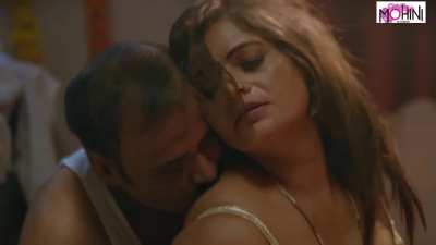 In this steamy Indian erotic short film, the handsome tailor uncle, Mohinibob, visits a beautiful young housewife, Mohinilaxmi, at her home to take measurements for a new outfit. As the sultry woman seductively poses, the lustful tailor can't resist his d
