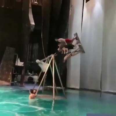 Triple flip off a pendulum swing