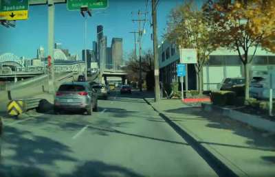 Angry biker kicks Lime Scooters off Seattle sidewalk. Ran over a handlebar in my month old Model Y.