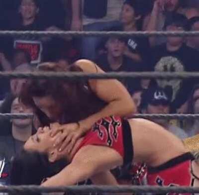 Mickie kissing Melina