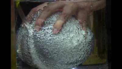 Popping a balloon underwater