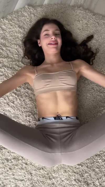 Yoga Stretching her Legs in Light Brown Leggings on the Floor (Yana Panda Clip)