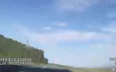 Car turns in front of author