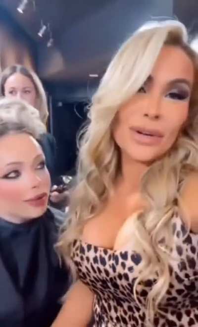 Liv checking out Natalya's big tits