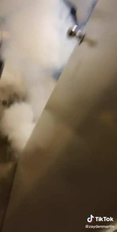 Battery explodes while guy smashes phone