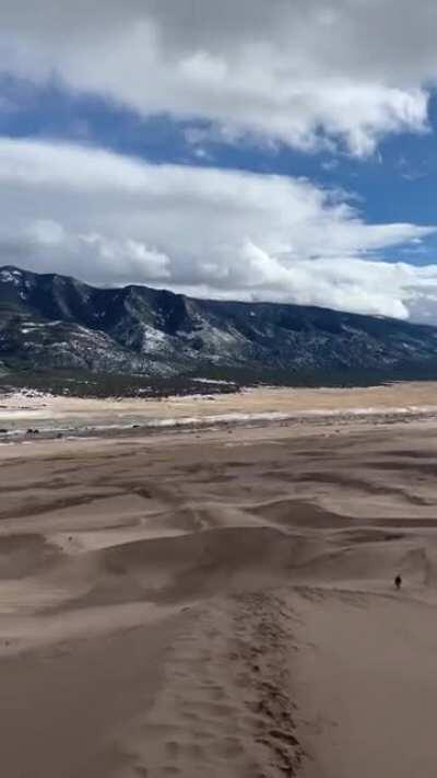 First time I’ve ever seen sand dunes touching mountains 🏔Colorado, you are insane.