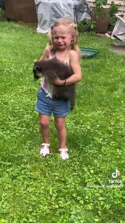 Girl wants to keep raccoon.
