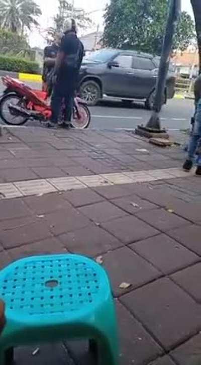 Headbutting a guy with a helmet. Lol.