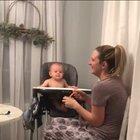 Baby laughs hysterically as mother fake sneezes.