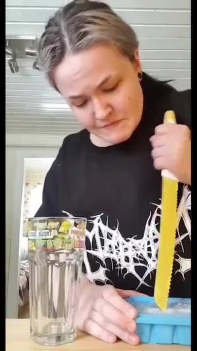 Girl struggling to get ice out