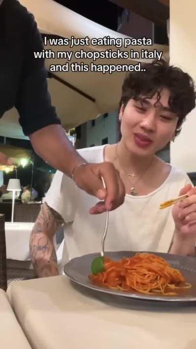To eat pasta with chopsticks in Italy