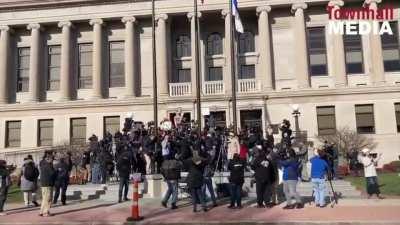Outside the courthouse Kyle Rittenhouse supporters cheer after hearing the 'not guilty' verdict.
