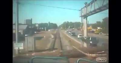 Train hits log truck