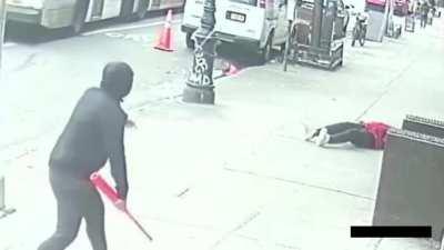Unsuspecting Man Hit in the Head with a Baseball Bat