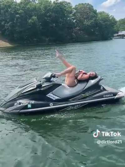 Ryder swinging legs on a jet ski