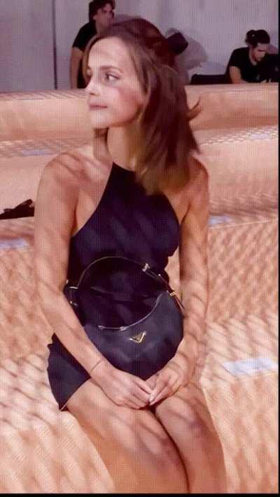 Emma Watson looks almost arrogant while she teases everyone with her legs