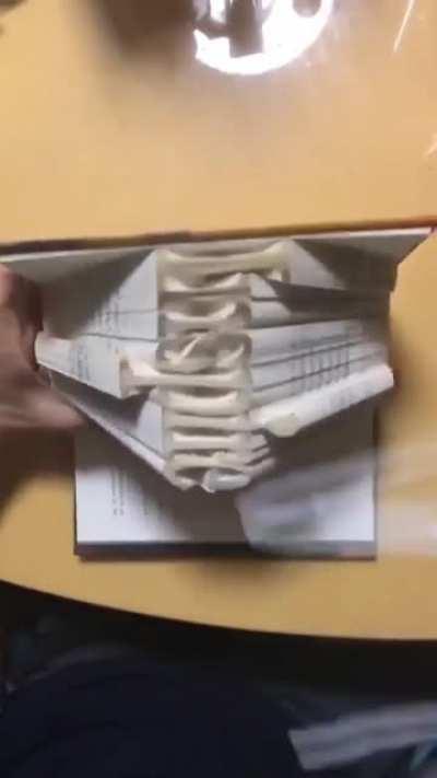 Folding book pages to spell 