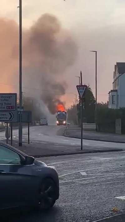 Truck on fire being escorted through a local town...
