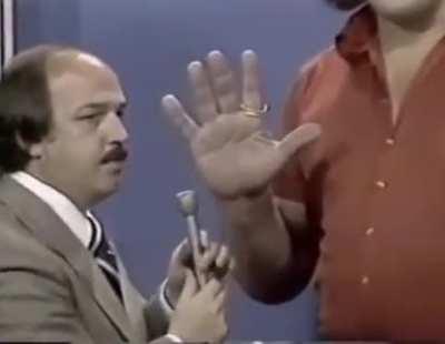 [1973] Andre The Giant showcasing the insane size of his hands.