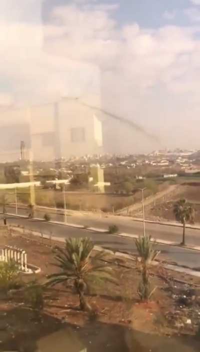 A Russian Aerospace Forces Ka-52 attack helicopter launches unguided rockets at militant positions on the outskirts of Homs