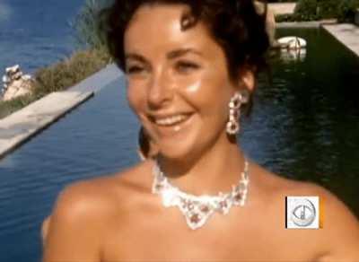 21 year old Elizabeth Taylor enjoying her new Cartier rubies (1957)