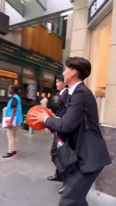 Throwing a basketball at random strangers